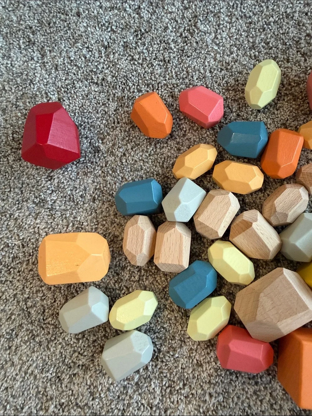 Lovevery bundle of Colorful Wooden Stacking Blocks, Light & Heavy Balls & Doll